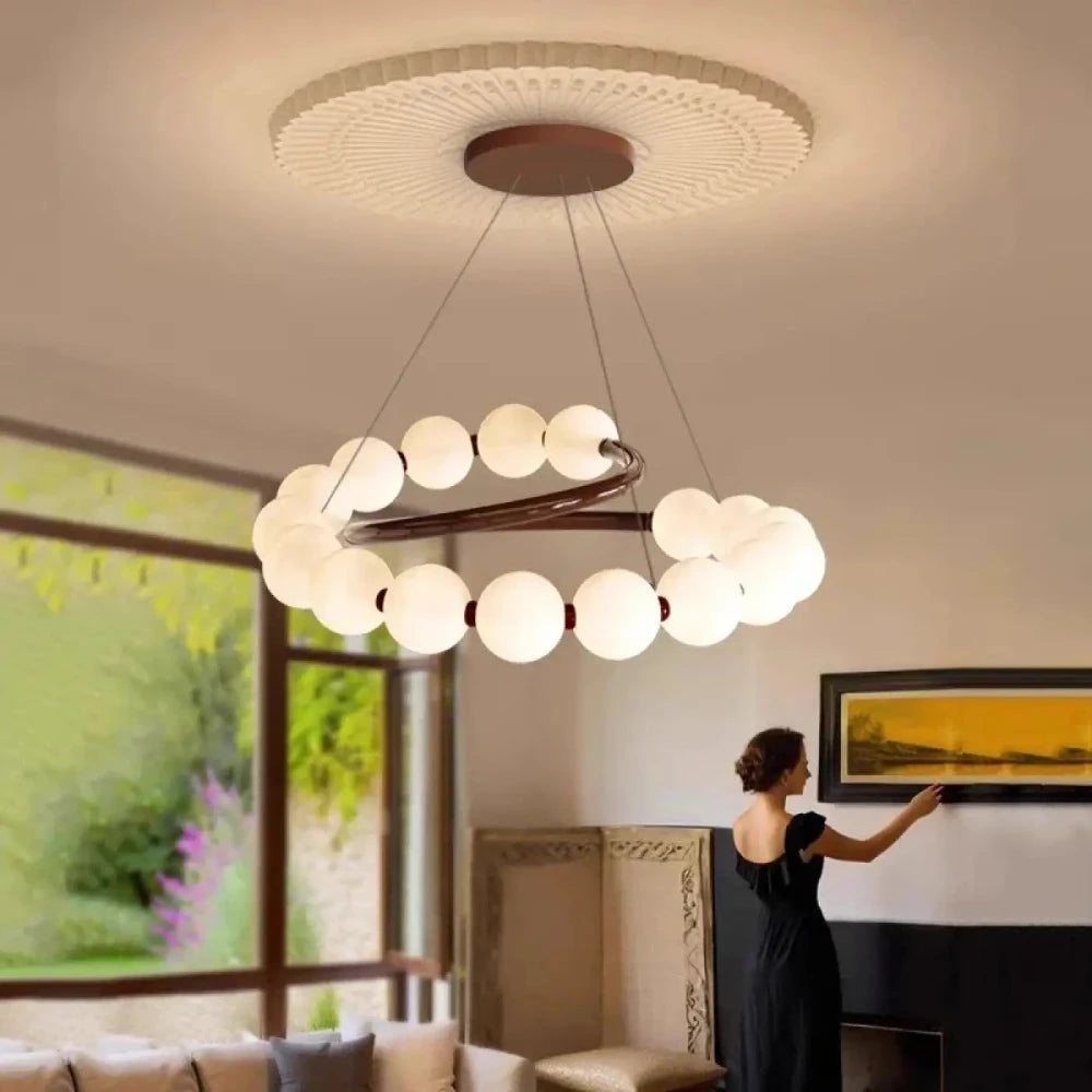 Lustre anneau cuivré boules opales blanches suspension salon